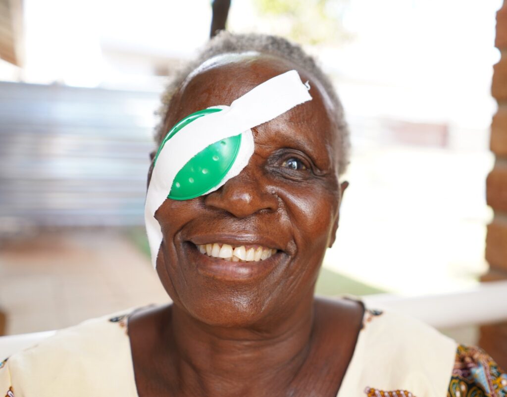 Patient smiling, recovering from cataract surgery